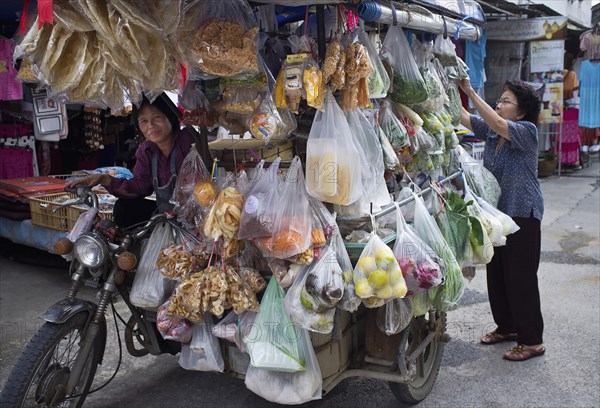 Thailand, Chiang Mai, San Kamphaeng mobile market on a motorcycle. 
Photo Martin F. Johnston / Eye Ubiquitous