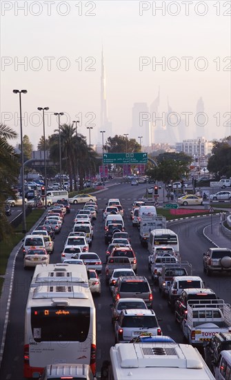 UAE, Dubai, Traffic in Deira during rush hour with skyline showing Burj Khalifa tower. 
Photo John Dakers / Eye Ubiquitous