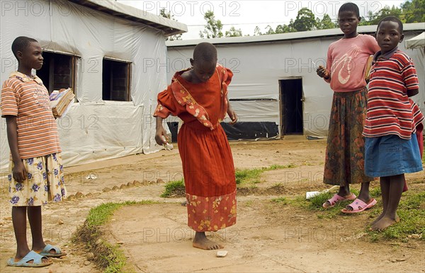 Burundi, Cibitoke Province, Mabayi, Primary School Girls playing hopscotch beside the Catch-up Class for children who have dropped out of school. Concern Worldwide has supported the establishment of a number of classes. 
Photo Nic I Anson / Eye Ubiquitous