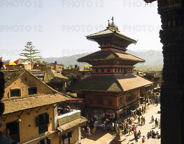 Nepal, Bhaktapur, Taumadhi Square View through pillars of temple of goddess Siddhi Laxmi. 
Photo Nic I Anson / Eye Ubiquitous