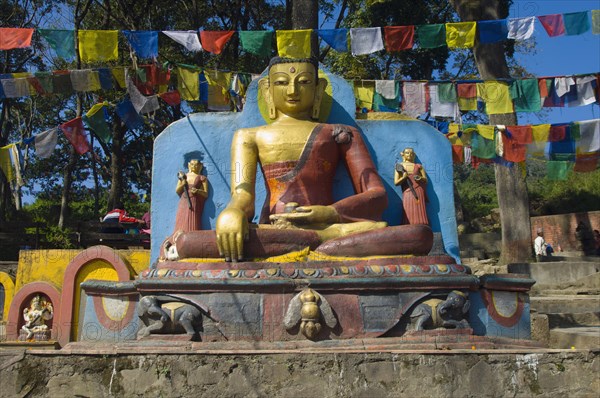 Nepal, Kathmandu, Buddha statue at the foot of the Swayambunath Monkey Temple. 
Photo Nic I Anson / Eye Ubiquitous