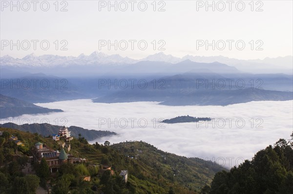 Nepal, Nagarkot, View across clouded valley towards Himalayan mountains. 
Photo Nic I Anson / Eye Ubiquitous
