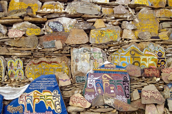 China, Szechuan Province, Tibet, Litang county Mani stone wall outside Litang Buddhist Monastery in Tibetan region. 
Photo Nic I Anson / Eye Ubiquitous