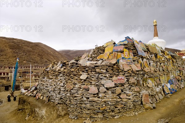 China, Szechuan Province, Tibet, Litang county Mani stone wall outside Litang Buddhist Monastery in Tibetan region. 
Photo Nic I Anson / Eye Ubiquitous
