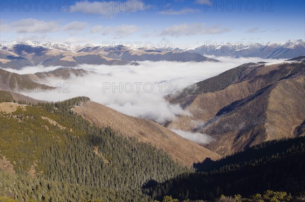 China, Szechuan Province, Tibet, High altitude view across mountains and valleys in Tibetan region of Litang county. 
Photo Nic I Anson / Eye Ubiquitous