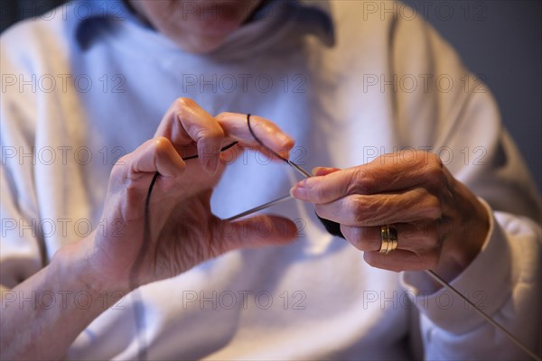 Crafts, Textiles, Knitting, Woman hand knitting wool together with needles. 
Photo Stephen Rafferty / Eye Ubiquitous