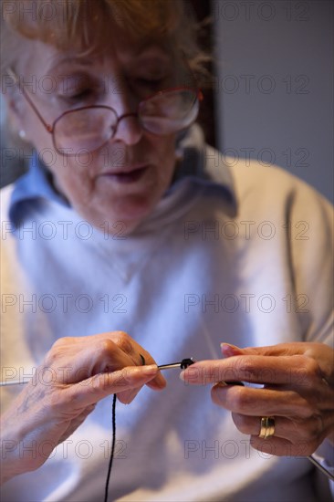 Crafts, Textiles, Knitting, Woman hand knitting wool together with needles. 
Photo Stephen Rafferty / Eye Ubiquitous