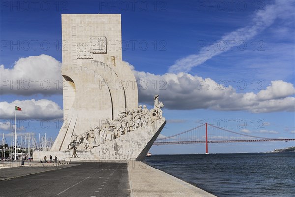 Portugal, Estremadura, Lisbon, Padrao dos Descobrimentos Carving of Prince Henry the Navigator leading the Discoveries Monument with the Ponte 25th Abril Bridge behind. 
Photo Hugh Rooney / Eye Ubiquitous