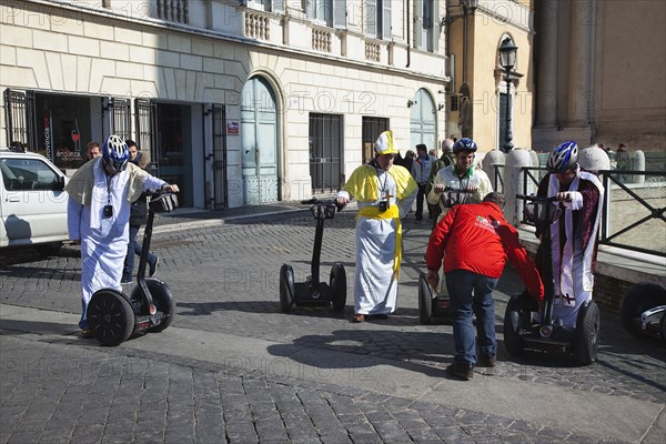 Italy, Lazio, Rome, Tourists dressed as Bishops to take tour on Segways. 
Photo Stephen Rafferty / Eye Ubiquitous