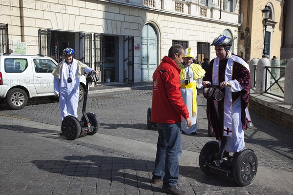 Italy, Lazio, Rome, Tourists dressed as Bishops to take tour on Segways. 
Photo Stephen Rafferty / Eye Ubiquitous