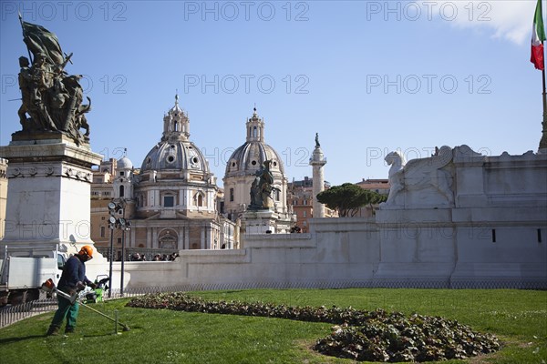 Italy, Lazio, Rome, Gardener using strimmer on the grounds of teh Victor Emannuel II monument. 
Photo Stephen Rafferty / Eye Ubiquitous