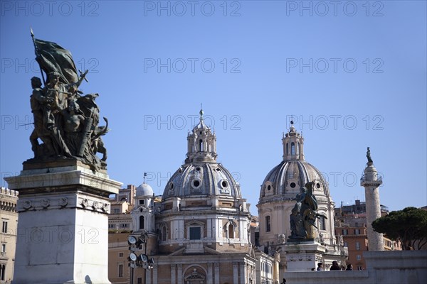 Italy, Lazio, Rome, Statue outside the Victor Emmanuel II monument with Church domes in the background. 
Photo Stephen Rafferty / Eye Ubiquitous