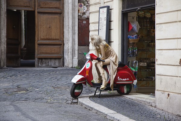 Italy, Lazio, Rome, Mannequin seated on Vespa outside tourist shop. 
Photo Stephen Rafferty / Eye Ubiquitous