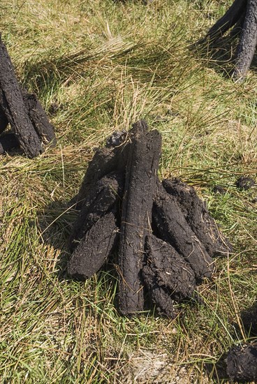 Ireland, County Sligo, Sligo, Peat stacks below Ben Wisken Mountain. 
Photo Hugh Rooney / Eye Ubiquitous