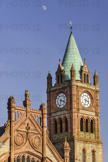 Ireland, North, Derry, The Guild Hall  The Clock Tower with moon in the sky above.