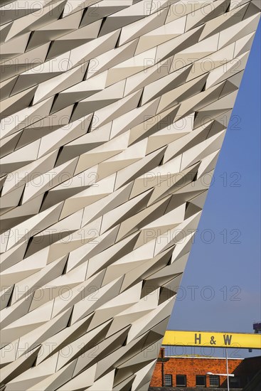 Ireland, North, Belfast, Titanic Quarter, Titanic Belfast Visitor Experience, Section of building with yellow Harland & Wolff crane. 
Photo Hugh Rooney