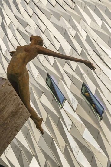 Ireland, North, Belfast, Titanic Quarter, Titanic Belfast Visitor Experience, 'Titanica' sculpture by Rowan Gillespie with section of the building in the background. 
Photo Hugh Rooney