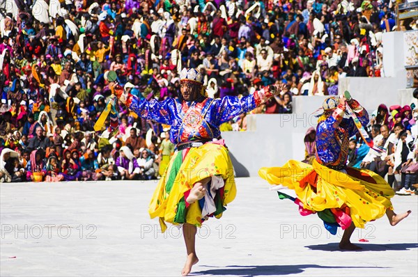Bhutan, Thimphu Dzong, Dancers in traditional Buddhist costume for the Tsecchu, or Masked Dance. . 
Photo Nic I'Anson
