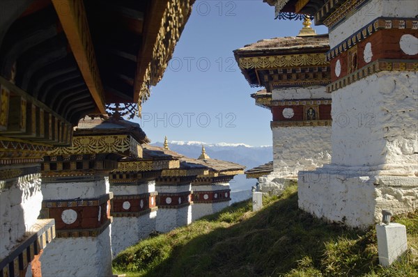 Bhutan, Dochu La, Chortens to commemorate victory of the 4th King in battle near Thimphu. 
Photo Nic I'Anson