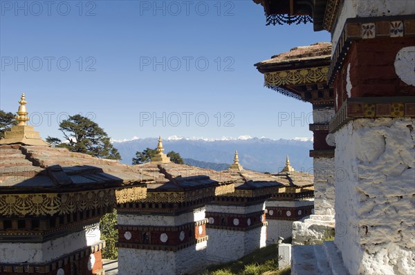 Bhutan, Dochu La, Chortens to commemorate victory of the 4th King in battle near Thimphu. 
Photo Nic I'Anson
