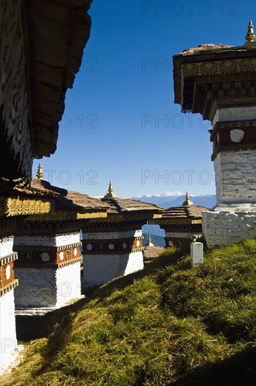 Bhutan, Dochu La, Chortens to commemorate victory of the 4th King in battle near Thimphu. 
Photo Nic I'Anson