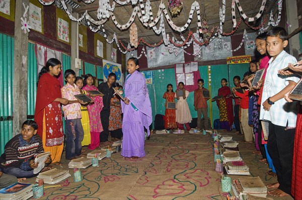 Bangladesh, Chittagong Division, Comilla, BRAC students in a primary school classroom. 
Photo Nic I'Anson