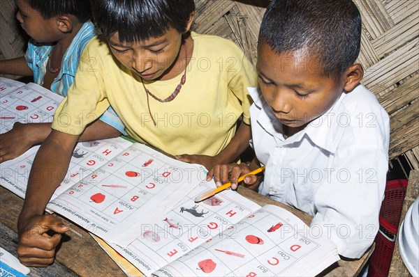 Bangladesh, Chittagong Division, Bandarban, Primary school classroom demonstrating child-centred group based work initiated by an NGO. 
Photo Nic I'Anson