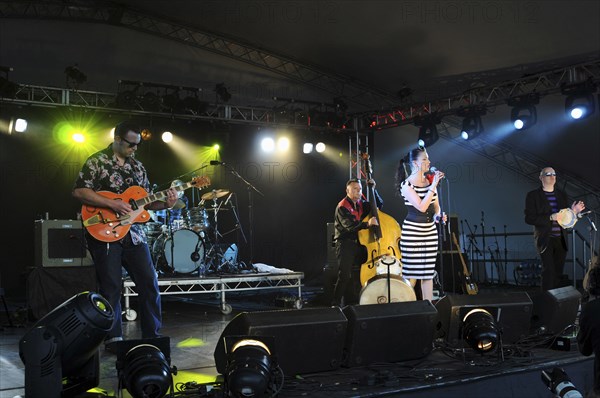 Music, Strings, Guitars, Irish Rockabilly singer Imelda May and her band performing at the 2010 Cornbury Festival. 
Photo Bob Battersby