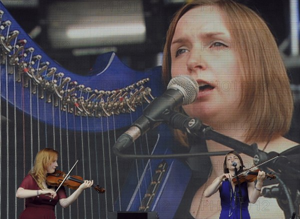 Music, Strings, Violin, Fiddle players from the Shee band playing at Cropredy 2011. 
Photo Bob Battersby