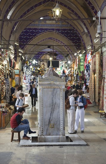 Turkey, Istanbul, Fatih, Sultanahmet, Kapalicarsi, Man washing his feet in the Grand Bazaar. 
Photo Stephen Rafferty