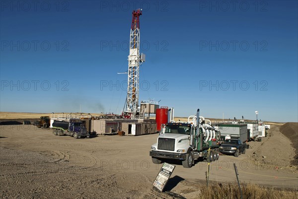 Canada, Alberta, Del Bonita, CanElson Drilling Inc of Calgary fracking for tight shale oil in a wheat field at the edge of the Bakken Play. 
Photo Trevor Page