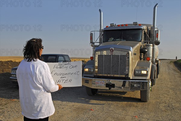 Canada, Alberta, Blood Reserve, Fracking for oil and gas on the Blood Tribe Indian Reserve at the edge of the Bakken Play. Anti-fracking protester Lois Frank blocks a GASFRAC truck engaged in fracking on the Blood Reserve. 
Photo Trevor Page
