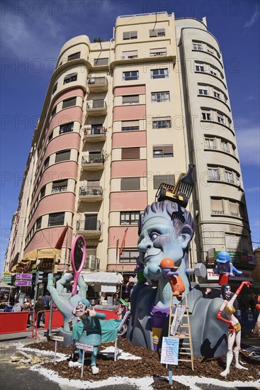 Spain, Valencia Province, Valencia, Typical falla scene with papier mache figures in the street during Las Fallas festival. 
Photo Hugh Rooney