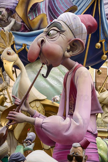 Spain, Valencia Province, Valencia, Papier Mache figure in the street during Las Fallas festival.