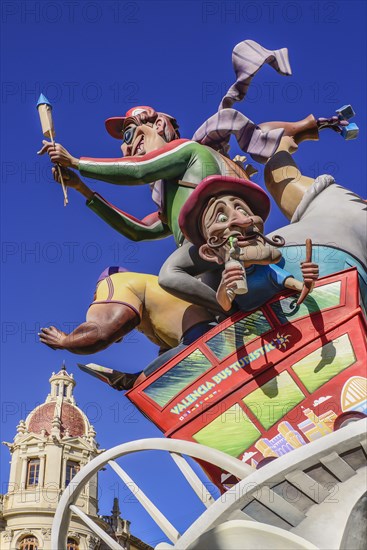 Spain, Valencia Province, Valencia, Las Fallas scene with Papier Mache figures on a Bus Turistic in Plaza Ayuntamiento during Las Fallas festival. 
Photo Hugh Rooney