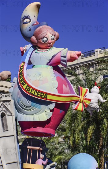 Spain, Valencia Province, Valencia, Las Fallas scene with Papier Mache figure on a Bus Turistic in Plaza Ayuntamiento during Las Fallas festival. 
Photo Hugh Rooney