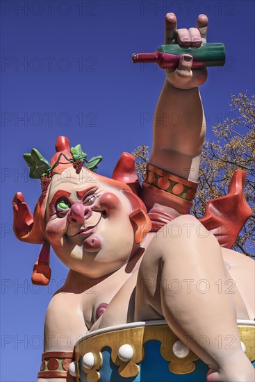 Spain, Valencia Province, Valencia, Grotesque Papier Mache figure at the Serranos Towers during Las Fallas festival. 
Photo Hugh Rooney