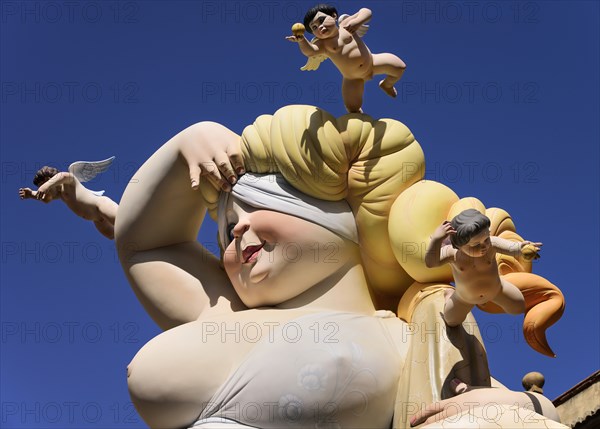 Spain, Valencia Province, Valencia, Falla scene with Papier Mache close up of a lady surrounded by cherubs at Torres de Quart during Las Fallas festival. 
Photo Hugh Rooney