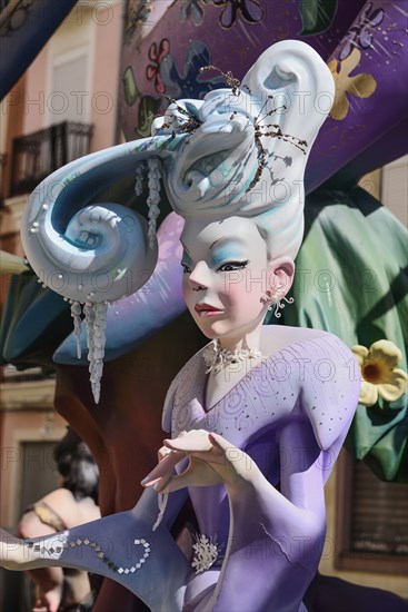 Spain, Valencia Province, Valencia, Papier Mache figure of well dressed lady in the street during Las Fallas festival. 
Photo Hugh Rooney