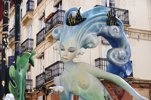 Spain, Valencia Province, Valencia, Papier Mache figure of mermaid in the street during Las Fallas festival. 
Photo Hugh Rooney