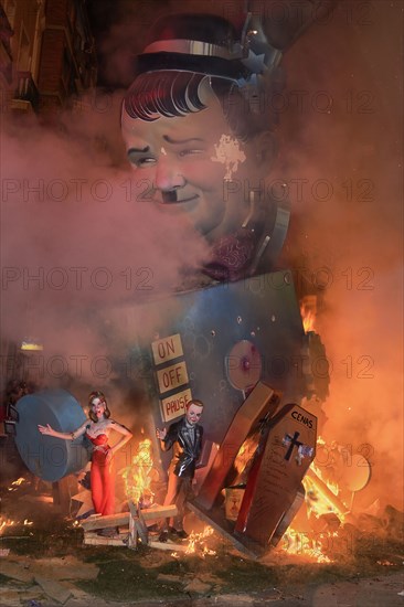 Spain, Valencia Province, Valencia, La Crema, The Burning of the Papier Mache figures in the street during Las Fallas festival on March 19th, Oliver Hardy going up in flames. 
Photo Hugh Rooney