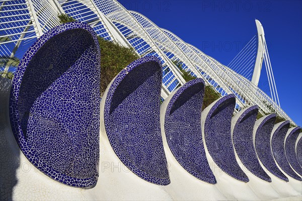 Spain, Valencia Province, Valencia, La Ciudad de las Artes y las Ciencias  City of Arts and Sciences  Arches of the Umbracle sculpture garden with El Pont de lAssut de lOr bridge in the background.