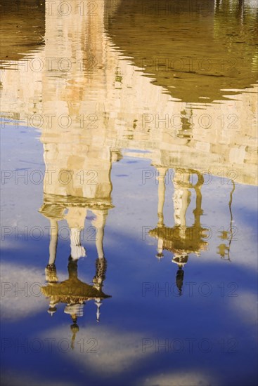 Spain, Valencia Province, Valencia, Spain, Valencia Province, Valencia, Puente del Mar reflected in a pool on the riverbed of the former Rio Turia which is now a park as the river has been diverted due to constant flooding of the city. 
Photo Hugh Rooney