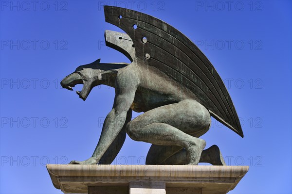 Spain, Valencia Province, Valencia, Puente del Reino  A gargoyle at the entrance to the bridge  Puente del Reino is one of many bridges over the former Rio Turia which now serves as a park as the river has been diverted due to constant flooding of the cit