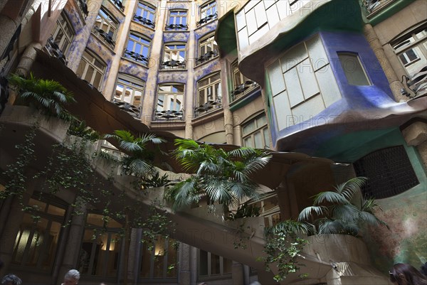 Spain, Catalonia, Barcelona, La Pedrera or Casa Mila on Passeig de Gracia, designed by Antoni Gaudi, covered staircase ascending from the courtyard. . 
Photo Stephen Rafferty