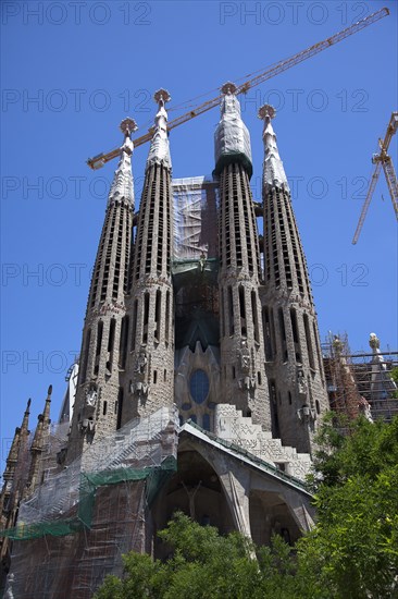 Spain, Catalonia, Barcelona, Eixample  exterior of La Sagrada Familia  designed by Antoni Gaudi.
