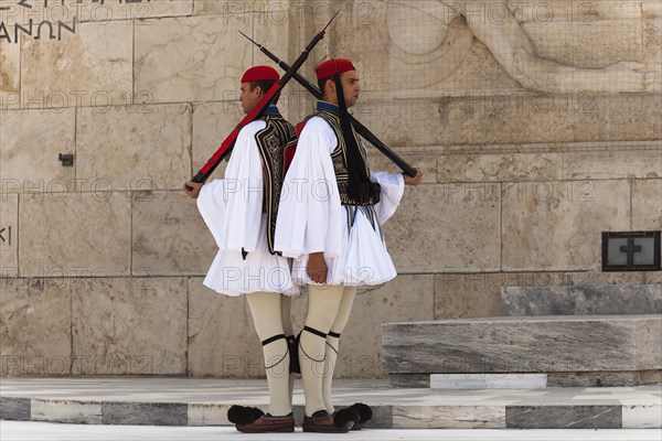 Greece, Attica, Athens, Greek soldiers, Evzones, beside Tomb of the Unknown Soldier, outside Parliament building. 
Photo Mel Longhurst