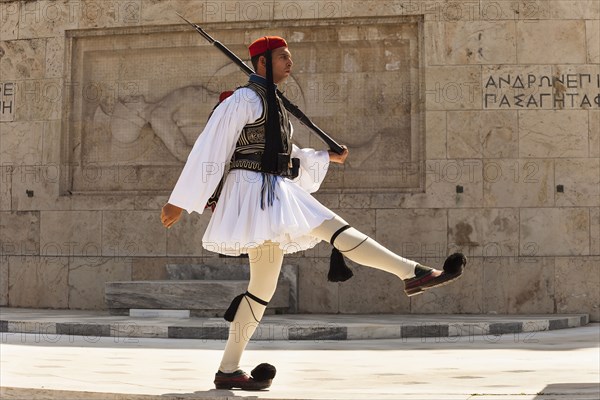 Greece, Attica, Athens, Greek soldier, Evzone, marching beside Tomb of the Unknown Soldier, outside Parliament building. 
Photo Mel Longhurst
