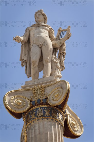 Greece, Attica, Athens, Statue of Apollo outside the Academy of Arts. 
Photo Mel Longhurst