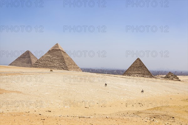 Egypt, Cairo Area, Giza, Great Pyramid of Giza, Pyramid of Khufu and Cheops, Pyramid of Khafre, Chephren and Pyramid of Menkaure. . 
Photo Mel Longhurst